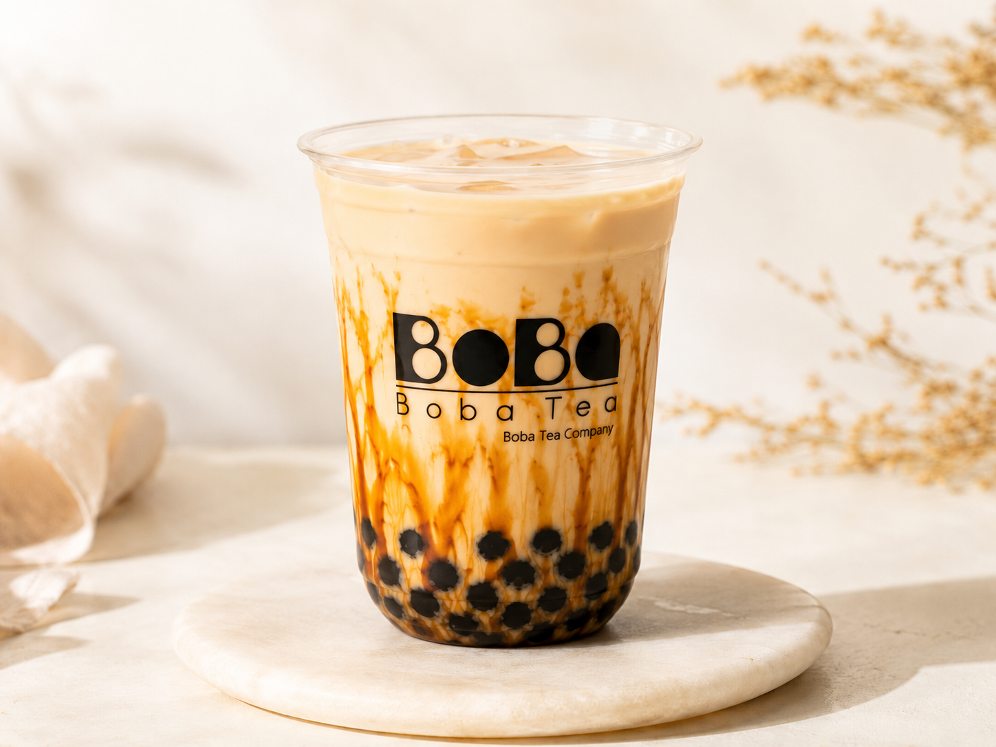 Brown sugar bubble tea in a clear cup with tapioca pearls — Boba Tea Company