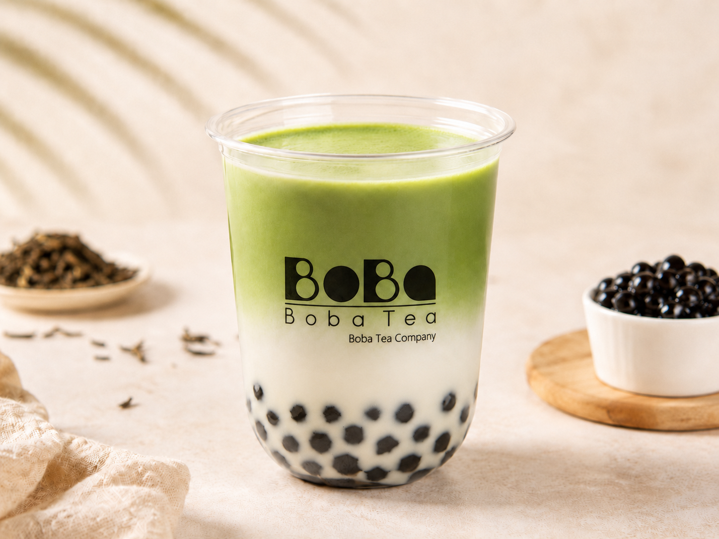 Matcha milk tea bubble tea in a clear cup with tapioca pearls — Boba Tea Company